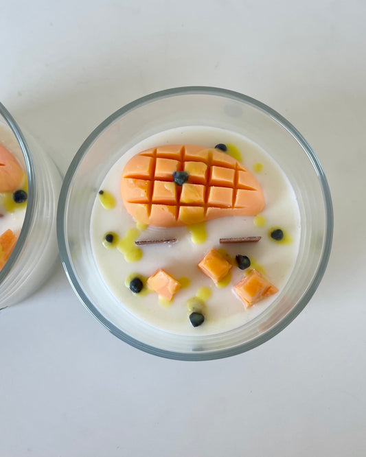 pavlova candle with double wood wick, wax carved mango slice and passionfruit seeds